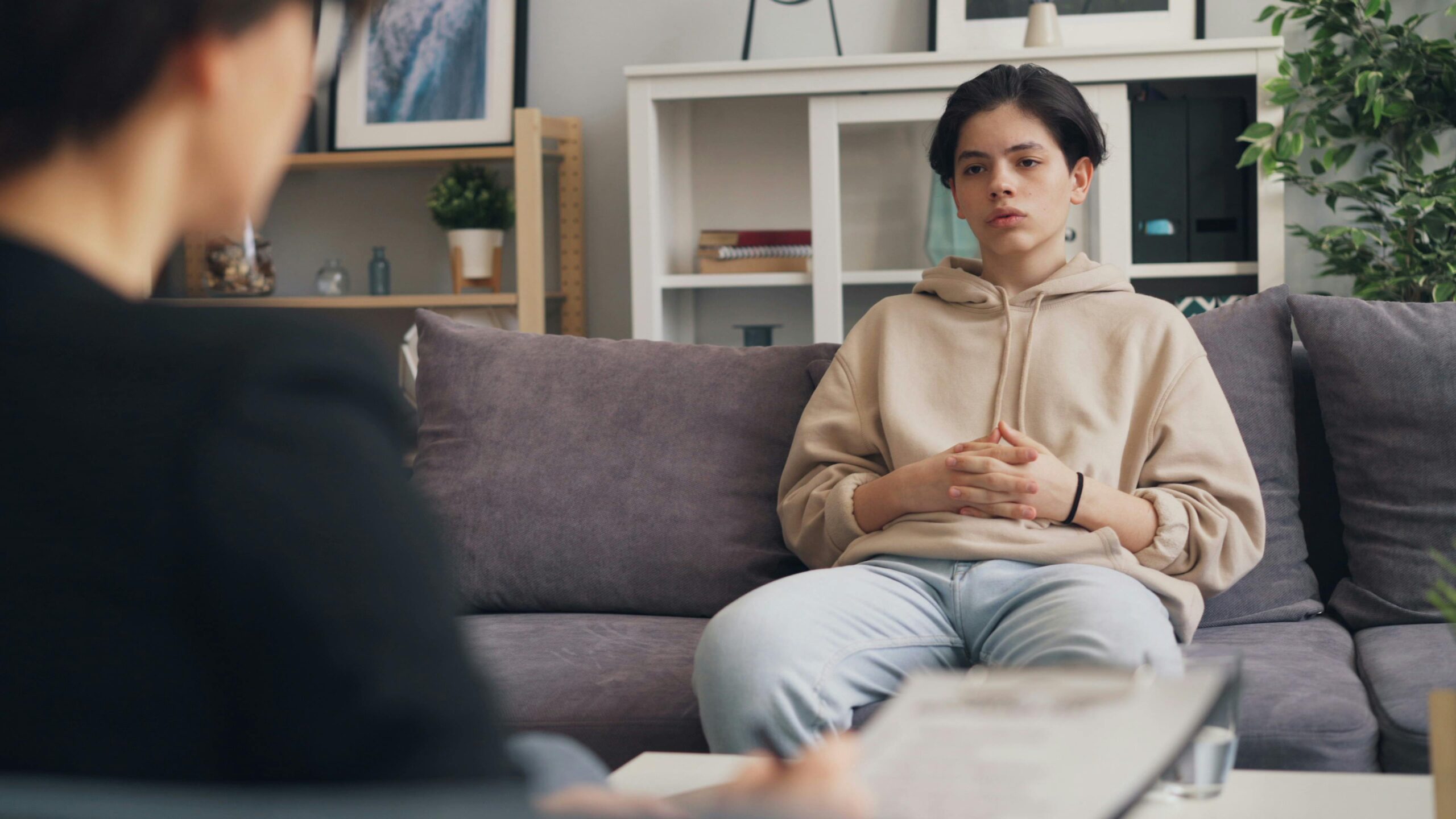 Teenager in a counseling session with a mental health professional discussing ADHD assessmen